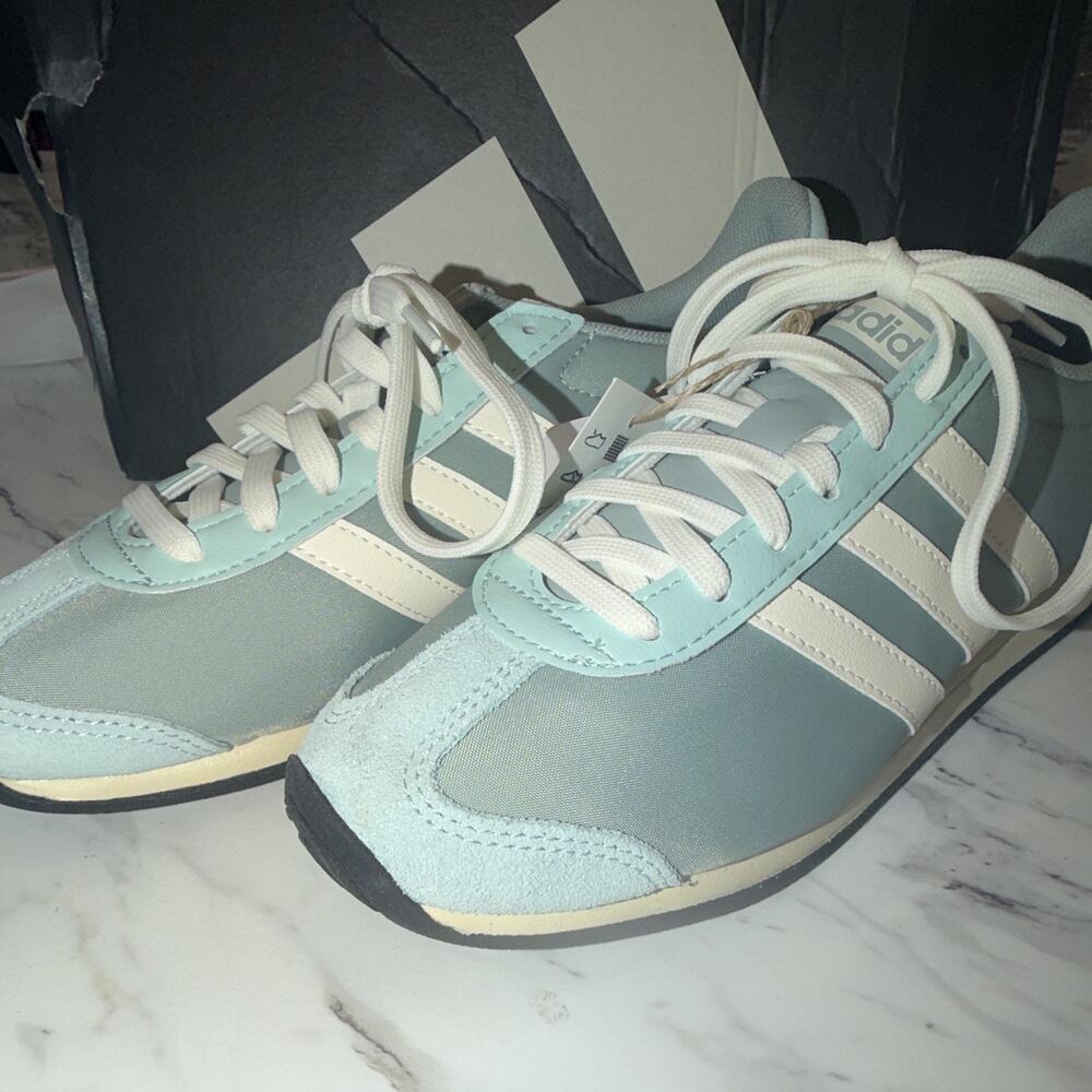 adidas Runvista women’s 
Low Top Lace-Up Athletic Sneakers Light Blue/White